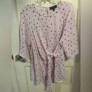 3/4 length sleeved pink top with light blue and white dots